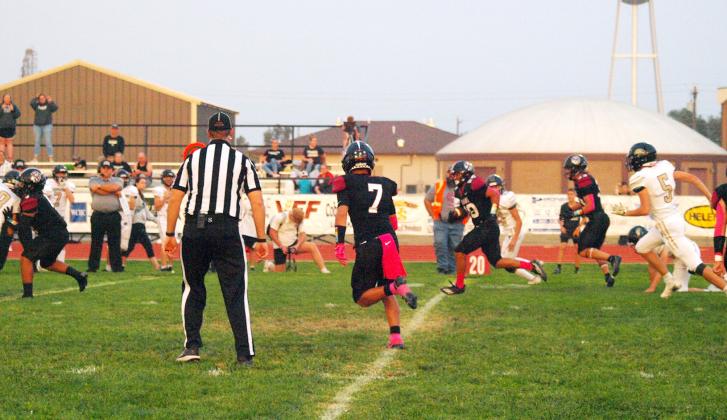 Freshman Rylan Schmidt (10) carries the ball for the Indians