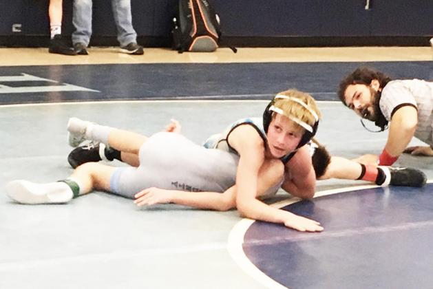 Above: Tayson Guerra, 72 pounds, competes in the 12 and Under division. He placed 2nd.