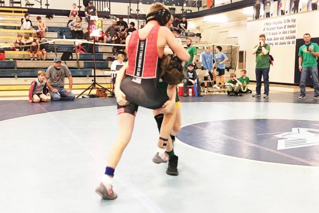 Below: Taydon West, 165 pounds, competes in the 14 and Under division. He placed 4th.