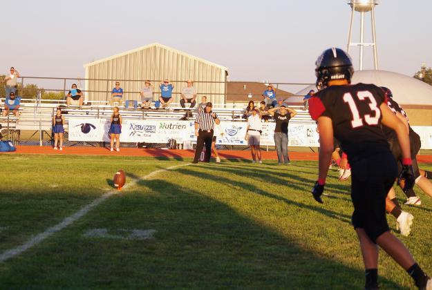 Ness City opted to receive to open the game. Gannon West (13) watches for the signal to go.