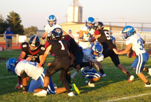 Beau Porter (8), Peters (1) and Gerstberger (59) block for Luna (7) on the rush.