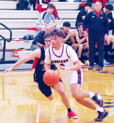 Above: Dylan Luna, 0, drives to the net.