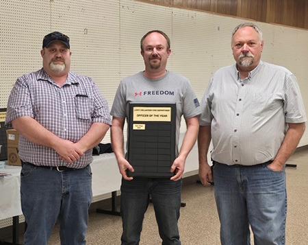 Leoti Volunteer Fire Department’s first Officer of the Year, Lt. Matt Price, center, poses with Assistant Fire Chief Mike Nickelson and Fire Chief Mike Nickelson.