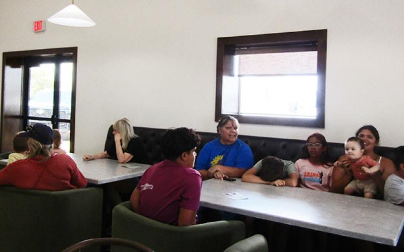 Below: Customers take in the first day of business.