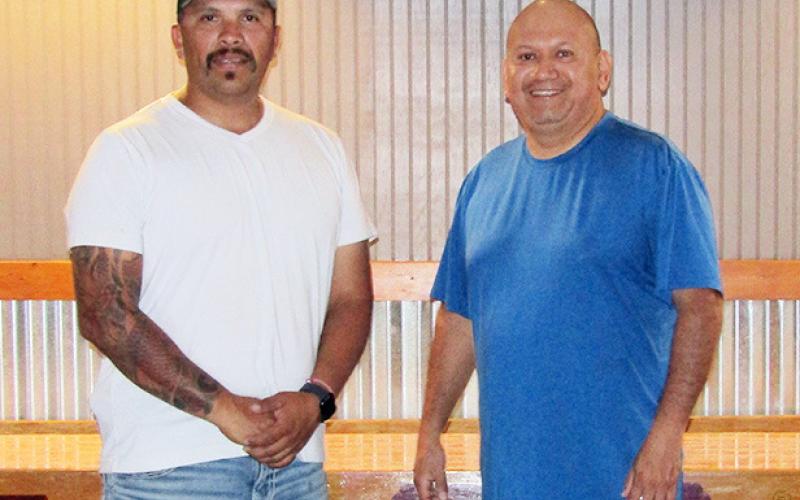 Above: Pete Luna, the owner of the new Salty Pete's poses with bartender Hector Heredia. Left: The interior of the longtime landmark boasts, among other things, new lighting, refreshed paint, and more televisions.