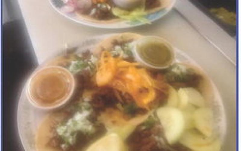 Left: Carlos and Yaquelin Rapalo pose next to the food-truck kitchen of their new restaurant in Leoti. Right: A couple of plates ready to make happy tummies.