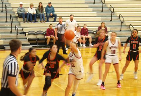 Audrina Marcy (11) goes after the ball as McKenzie Porter (10) guards her player.