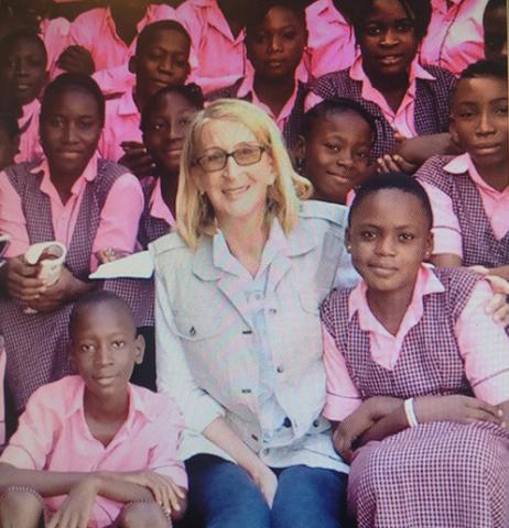 Missionary Phyllis Sortor surrounded by students. Provided