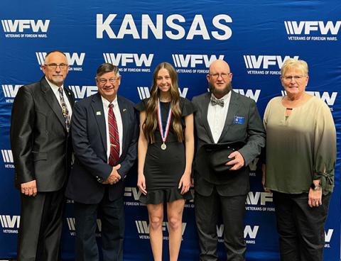Kansas Department Commander James Langley; 6th District Commander Jerry White; Addi Simons, 6th District Voice of Democracy 1st place; 6th District President Garrett Steggman, Department Scholarship Chairman Kim Butcher. Photo Provided.