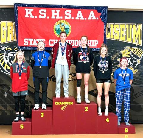 Jentri Porter tops the podium as State Champion Wrestler. More photos pg 9.