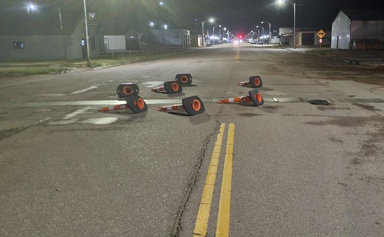 Traffic cones on 4th Street (Hwy 25) were knocked over during Saturday’s storm. Reminds your editor of the “We Shall Rebuild” patio furniture meme.