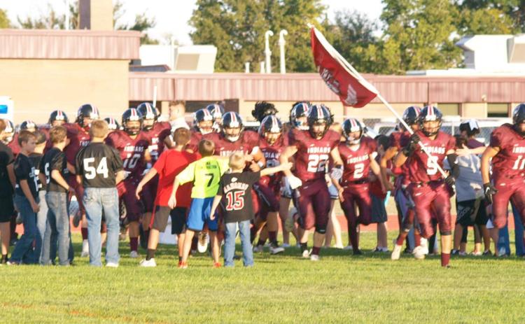 Young Indians faithful greet the team as they prepare to take the field against Hodgeman County.