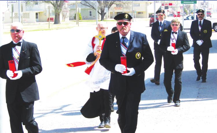 Pictured above (front to back, left to right) accompanying the Father are Knights of Columbus members Brett Ridder, Jeff Ridder, (unseen) Bryer Porter, Kurt Graff, Matt Long, and Tom Ridder. (Staff Photo)