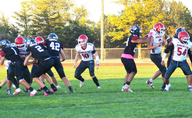 Huck Carpenter (2) forces the ball through the D-Line of the Sublette Larks with help from Tyson Peters (1) and Chase Carpenter (42)
