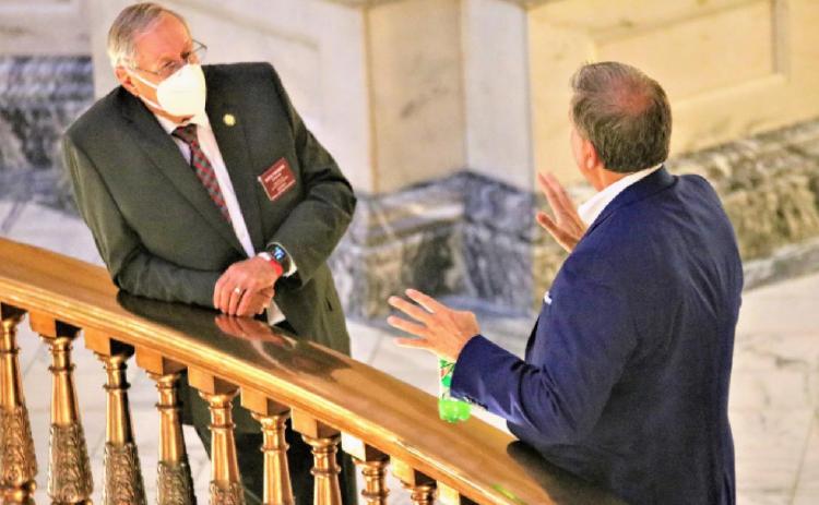 State Rep. Richard Prohel, a Republican from Parsons, listens to lobbyist John Federico. Photo Credit: Jim McLean