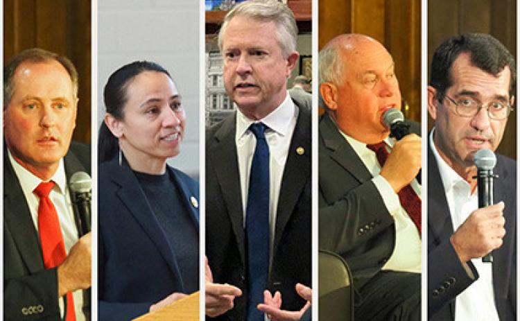 From left, U.S. Reps. Tracey Mann and Sharice Davids, U.S. Sen. Roger Marshall, and U.S. Reps. Ron Estes and Derek Schmidt are defending their seats against 25 challengers in the August primary election. (Photo illustration by Anna Kaminski/Kansas Reflector)