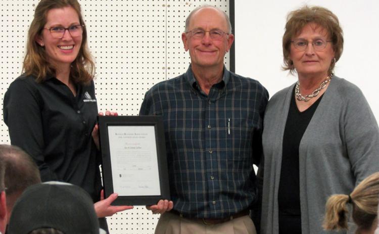 Above (L-R): Simone Elder, Western State Bank, presents the Conservation Award certificate to Joe and Connie Zellner at the Wichita County Conservation District Annual Meeting.