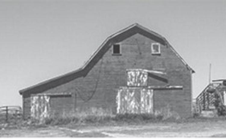 An old barn stands on an abandoned homestead in southwest Kansas. (Kevin Hardy/Stateline)