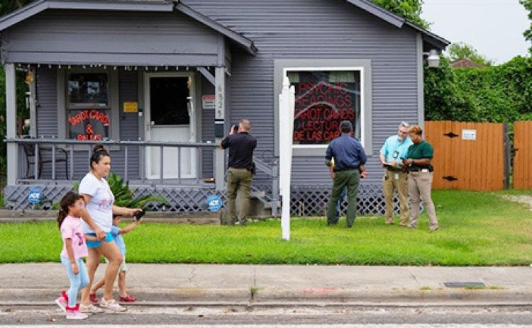 Investigators work near the Houston location of a fatal ICE shooting July 7. (Photo by Jon Shapley/The Texas Tribune)