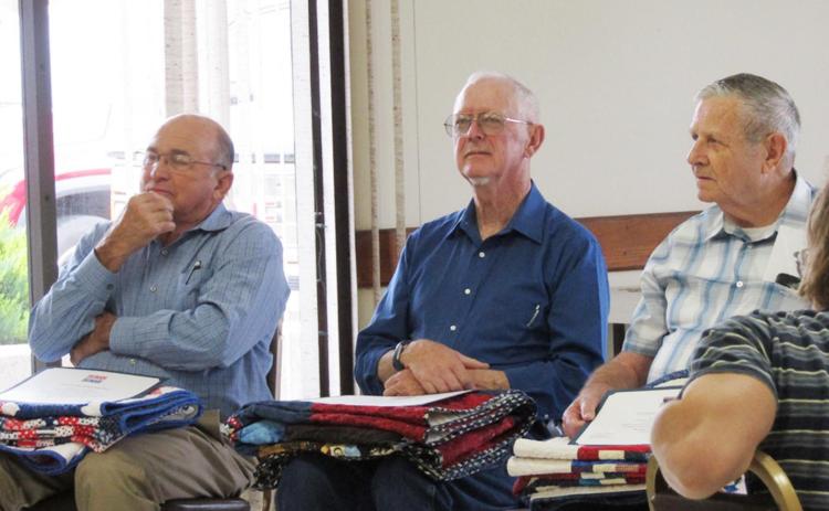 Veterans (L-R) Jimmy Hahn, David L Brandt, and Jack Dizmang were honored with Quilts of Valor at the Senior Center last Saturday. Staff Photo