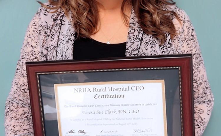 Teresa Clark, CEO of Wichita County Health Center, poses with her framed NRHA Certification. (Provided)