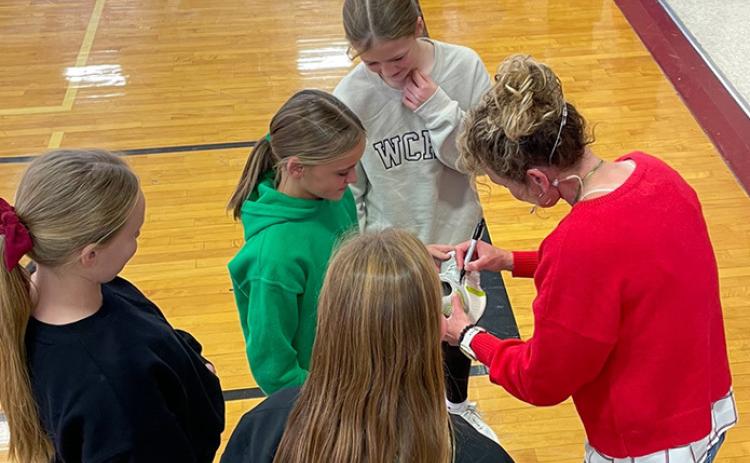 Above: Claflin, Kansas, native and Women's National Basketball Association (WNBA) legend Jackie Stiles returned to Wichita County schools as part of the Reading Warriors program. She shared her personal journey from her Claflin beginnings to WNBA stardom. Clockwise from the bottom: Jazlin Fritzmeier, Jessa Berry, Macy Ames, Ainsley Bauck, Jackie Stiles. Photo provided by Lori Maxwell