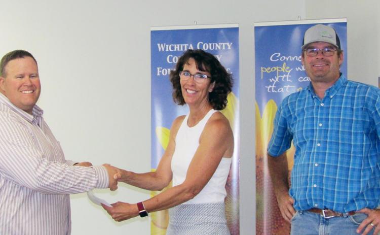 The Wichita County Fair Board received $10,000 to be used for the new Pavilion. Pictured above are Russ Lewis, Deb Smith, and Joe Biermann.