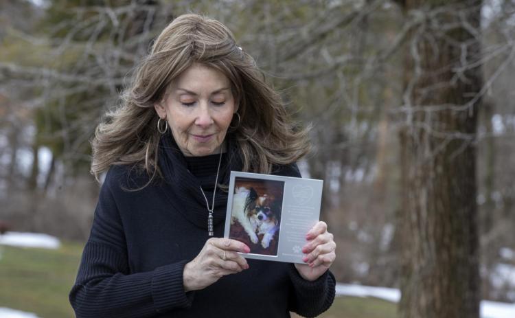 Rhonda Bromwell of Somerset, NJ, holds a memorial for her dog, Pierre, who died after wearing a Seresto-branded flea collar.