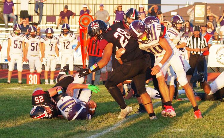 Holden Whalen (25) takes down the Oakley quarterback.
