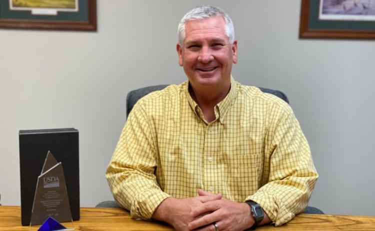Kearny and Wichita County Executive Director Mark S. Goudy poses with his FSA Administrator’s Award. Provided