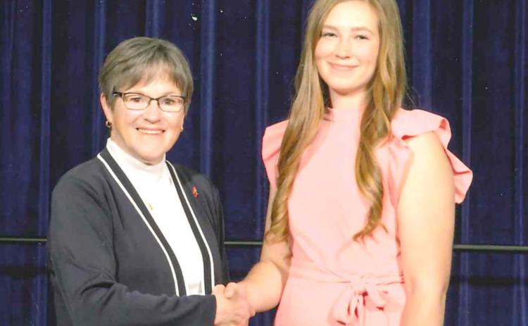 WCHS Senior Amelia Koehn meets Governor Laura Kelly at the Governor’s Scholars Awards Program in Topeka on May 1.