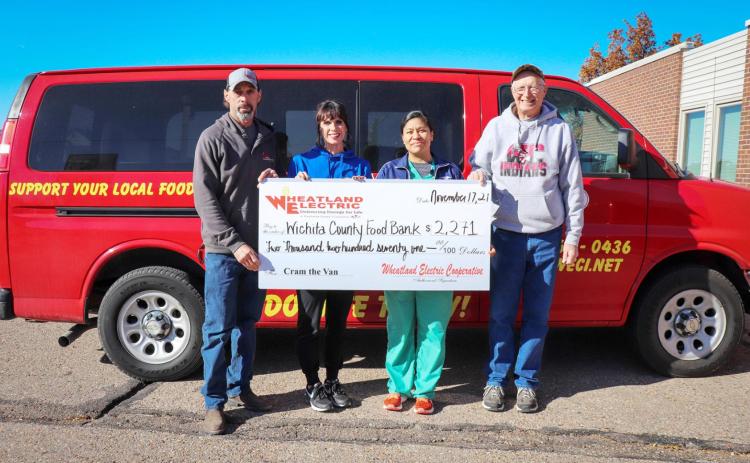 The Wichita County Food Bank received a check for $2,271 in addition to food donations from our 2021 Cram the Van season. A total of 3,051 lbs. were raised for the Wichita County community. Pictured here (from left) are Wheatland employees Kelley Burch, area wide supervisor, and Alli Conine, manager of member services and corporate communications, with representatives of the Wichita County Food Bank.