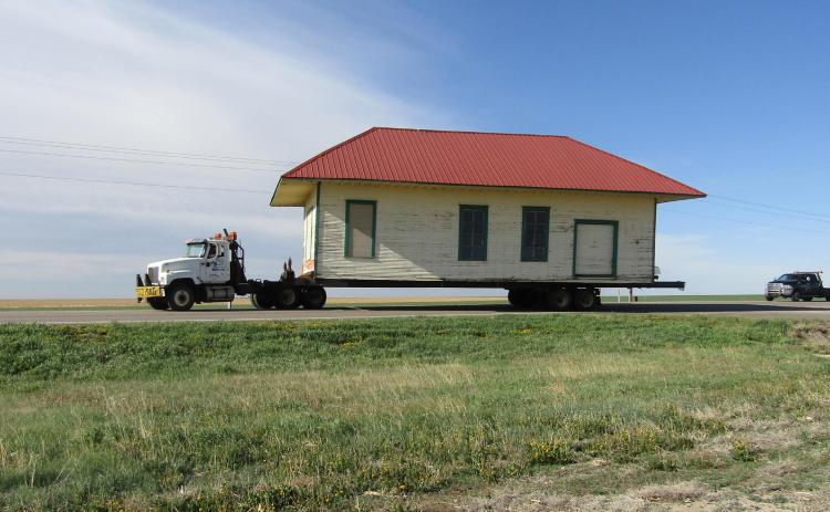 The Wichita County Historical Society's depot begins its serpentine journey from Selkirk, Friday, May 1, 2020. Its new home is beside the AT&amp;SF caboose behind the Museum of the Great Plains, in Leoti. The two attractions have proven popular with the public.