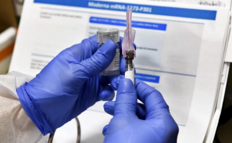 Studies of a possible COVID-19 vaccine have been paused while a safety review is conducted. Hans Pennink/AP
