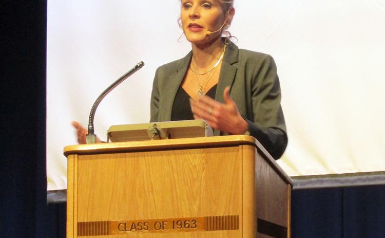 Left: Former WNBA player and Claflin (Kansas) High School graduate, Jackie Stiles, speaks at WCJSHS.