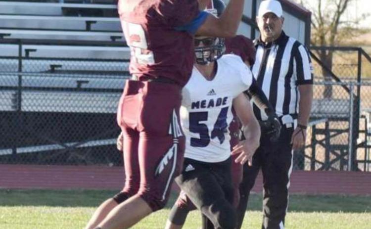 Sophomore Isaiah Gerstberger (12) leaps for a nice catch.