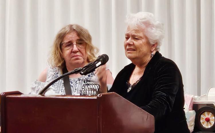An emotional Kelma Burch accepts her Outstanding Member of the Year award at the Kansas Rural Letter Carriers' Association convention in Wichita.