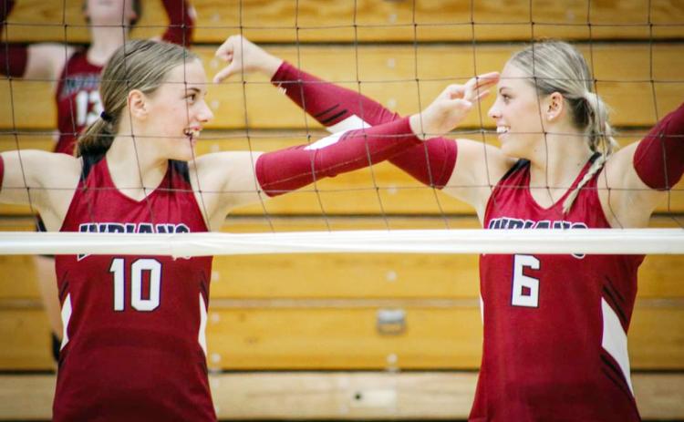 Kenzie Porter and Emma Berning participate in the Jamboree for the Lady Indians. Photo by Hallie Means