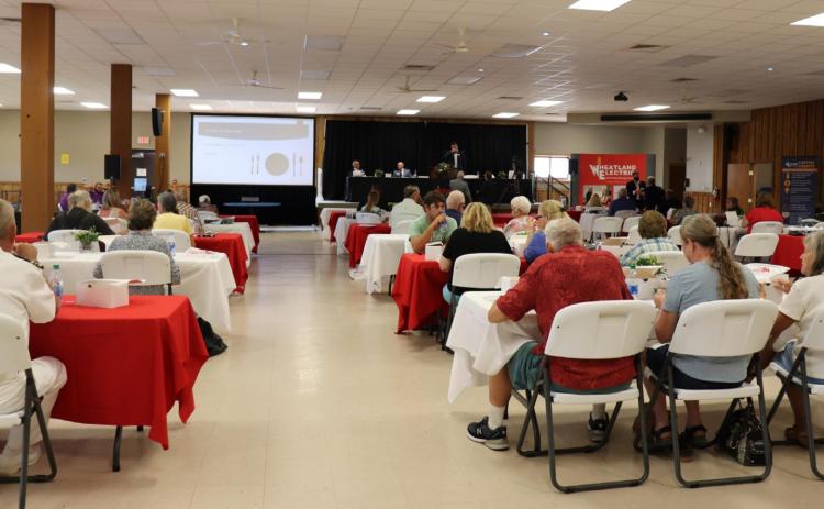 Members eat a grab-and-go boxed lunch in the Caldwell Community Building in Caldwell during the 2020 Wheatland Electric Annual Meeting on Aug. 26. Photo courtesy Wheatland Electric