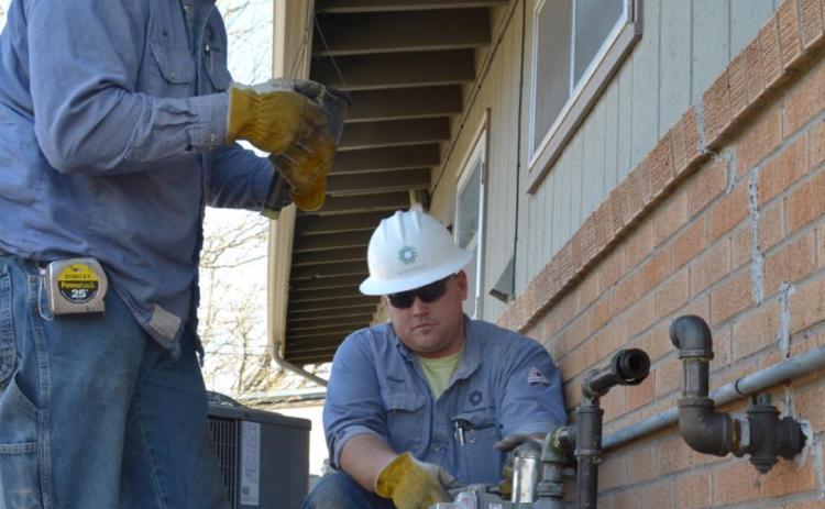 Above (L to R): Kyle Pfannenstiel and Shaun Burd, both Apprentice Gas Maintenance persons with Midwest Energy in Hays, connect a gas meter set to a home in Hays. Midwest Energy’s gas division, the only natural gas cooperative in Kansas, was one of just 15 companies nationwide to win the American Public Gas Association’s prestigious System Operational Achievement Recognition (SOAR) award, measuring system integrity, improvement, employee safety and workforce development.