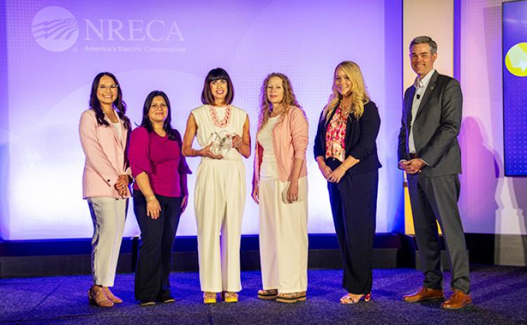 Wheatland Electric Cooperative, Inc. is presented with the Edgar F. Chesnutt Award at NRECA’s 2026 Connect Conference in San Diego, Calif. Pictured (from left) is the Member Services team: Samantha Garcia, Shajia Donecker, Alli Conine, Mary Hoisington, Caitlin Moser. Also pictured is Stephen Bell (far right), NRECA’s senior vice president of communications. (Photo: Jerry Mosemak/NRECA)