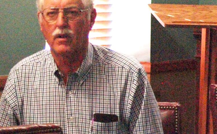 Above: Jim Minnix, state representative for the 118th district, of which Leoti is a part, pays careful attention to the conversation.
