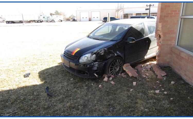 Friday morning car accident sends one vehicle careening into the corner of the Wichita County Library