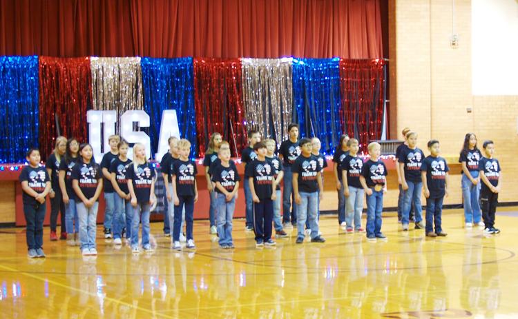 WCES students prepare to honor veterans with a performance at their Veterans Day program.