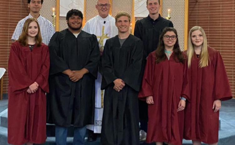 Above right: Front row (L-R): Laney Crouch, A.C. Hermosillo, Waylon West, Hope Gerstberger and Sophie Gerstberger; Back Row (L-R): Connor Krenzel, Father Tim Hickey and Myles Conard.