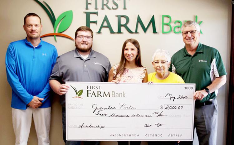 The Tribune First Farm Bank personnel (L-R): Trevor Carney, Hunter Means, Marlen Kuder, and Alan Peter flank WCHS 2026 graduate Jentri Porter. Photo Courtesy Christy Hopkins, The Greeley County Republican.
