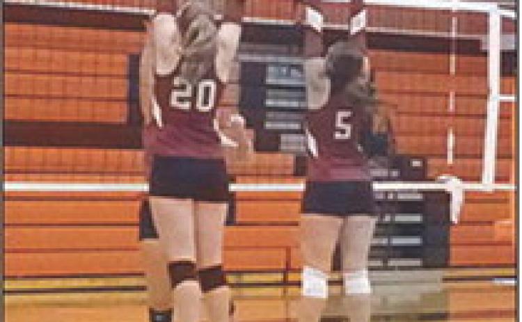 Jenn Koehn and Jayah Case block against Southwestern Heights offense. Photo: Jessica Case