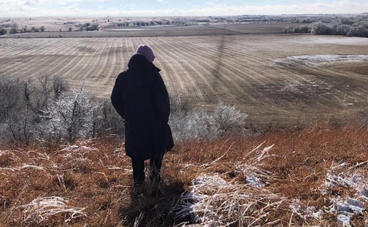 The Keystone runs beneath a soybean field on the Pannbacker farm in Washington County. It’s visible on snowy days because the warm, underground pipe melts the snow. The diagonal line cutting across the field is the pipeline. Much of the oil released on Dec. 7 spilled onto native prairie that the Pannbackers use for grazing cattle. Some oil splattered into this field. Chris Pannbacker stands on a ridge overlooking the field last month. Celia Llopis-Jepsen/Kansas News Service