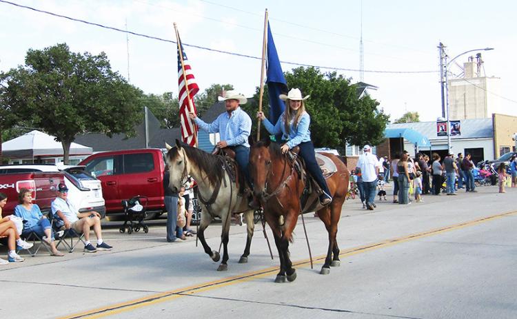 Flag-bearers Colton and Lauren Sheppard kick off the festivities.