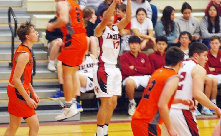 Below left: Leoti’s Romeo Terriquez goes for the shot, while the Hornet behind him appears to levitate.